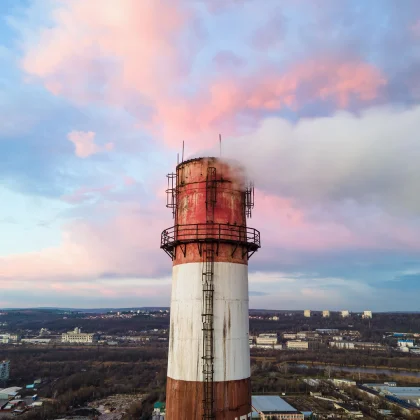 aerial-drone-view-thermal-station-sunset-with-smoke-coming-out-tube
